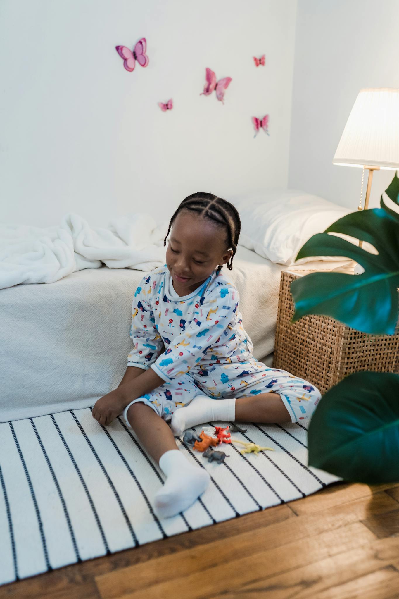 A Young Child In Pajamas Playing With